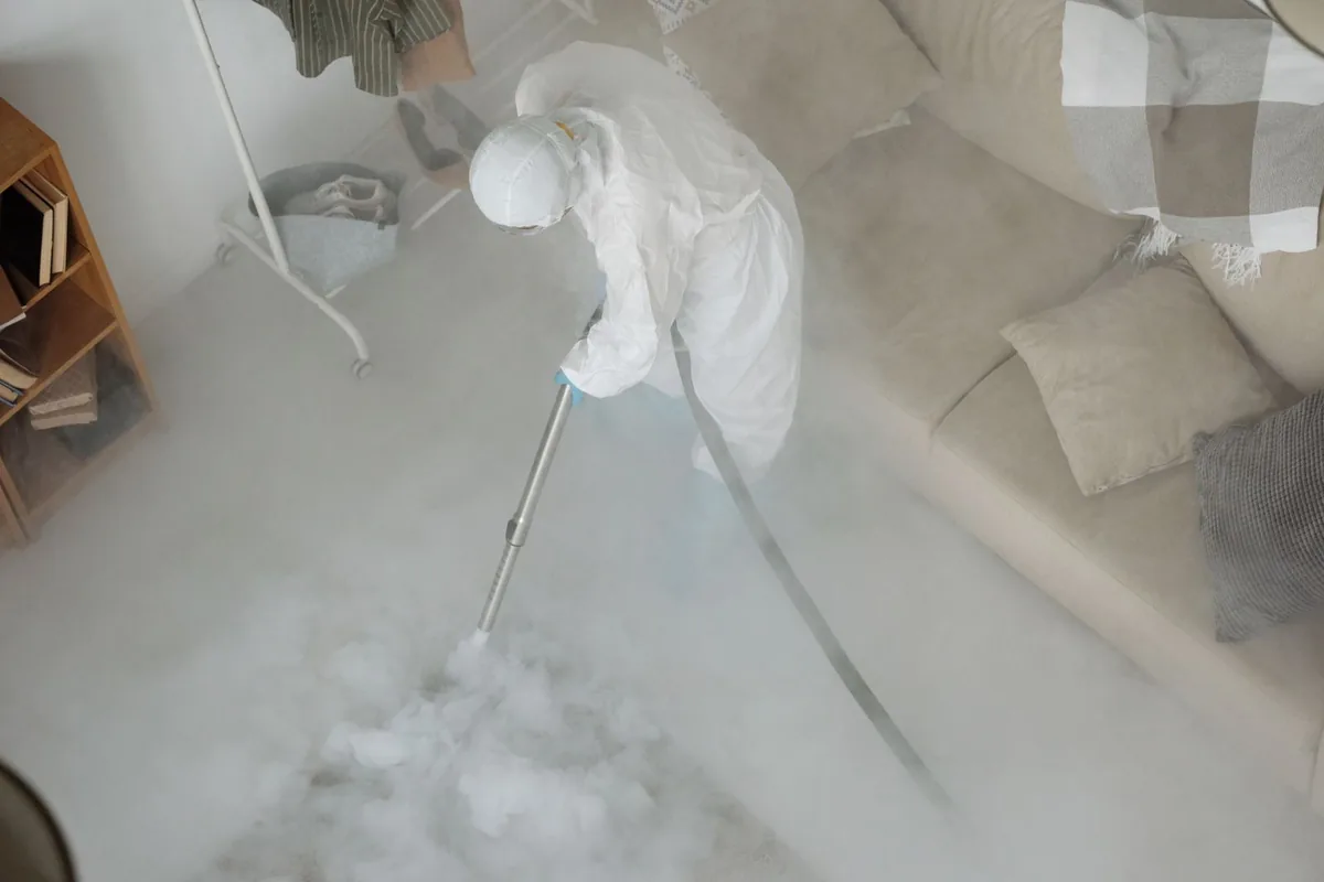 Biohazard cleanup technician in protective equipment, Patton, PA